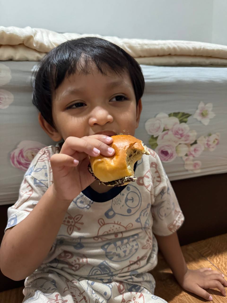 Young boy eating a sandwich